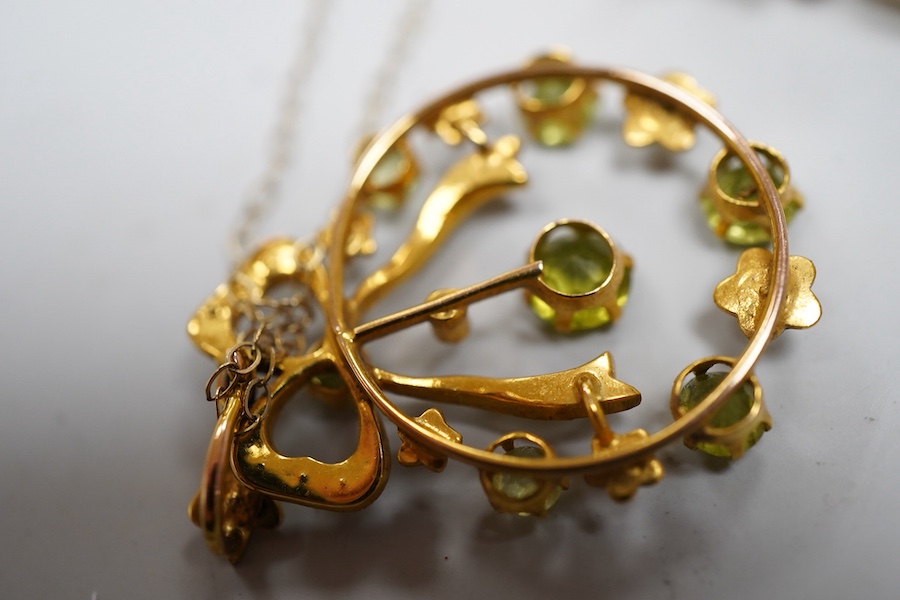 Two Edwardian peridot and seed pearl jewels, early 20th century, comprising: a bar brooch and a pendant, each of foliate design, set with circular-cut peridots and seed pearls, mounted in gold, brooch length 3.5cm, maker